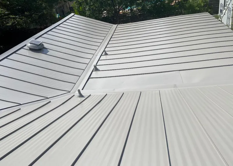 Solar attic fan installed on a metal roof for Roof Ventilation in Maxatawny
